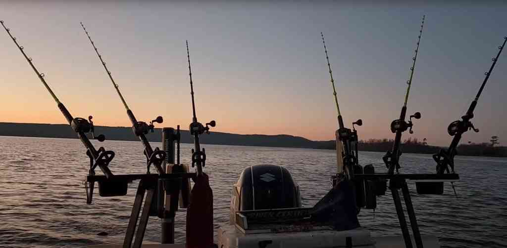 A serene winter sunset sets the stage for an evening of catfishing, with Hellcat rods front and center.